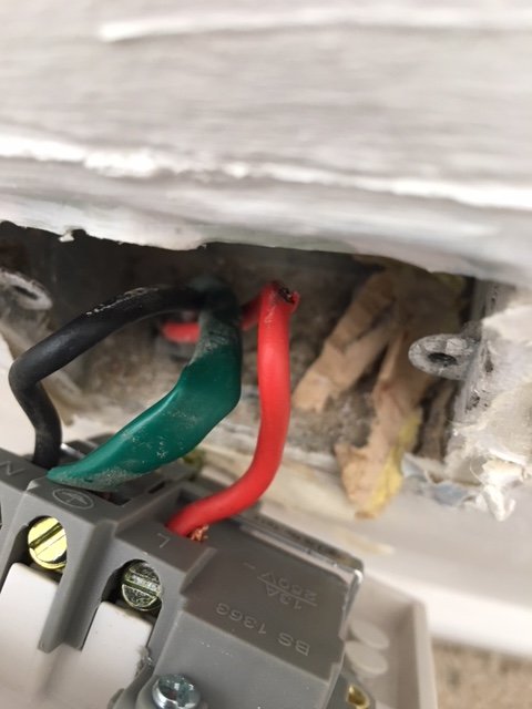 slightly exposed live wire behind plug socket | DIYnot Forums